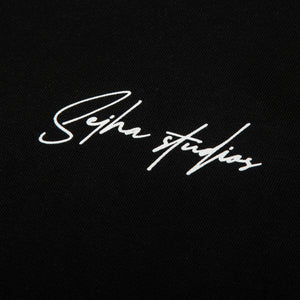 SEIHA STUDIOS – T-Shirt Oversize "Praying for the Plug" (Black)